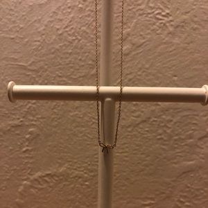 Tiny gold bow necklace